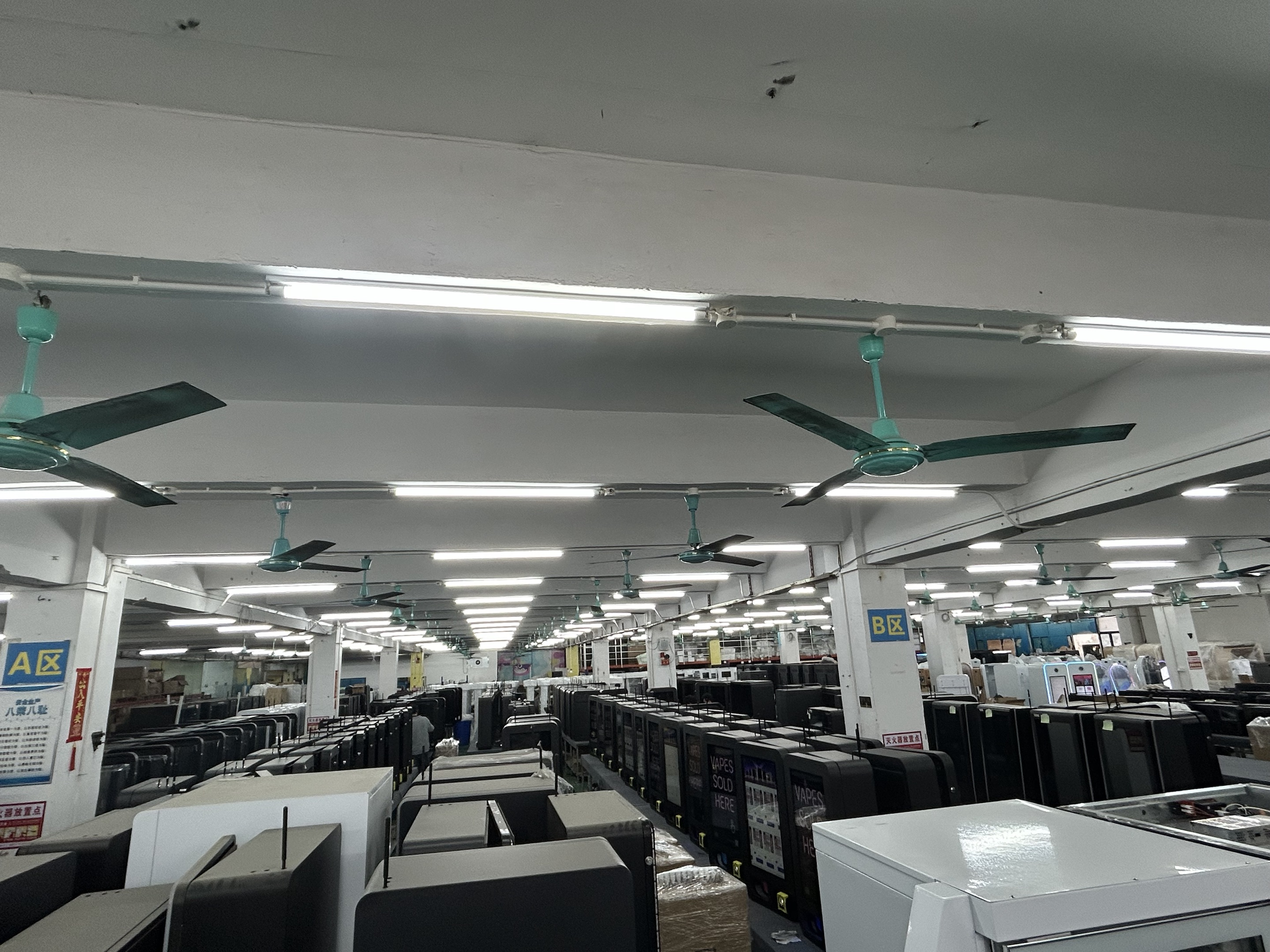 Rows of vending machines on the Reyeah factory floor